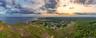 Aerial overview of property's location with a large body of water