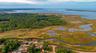 Aerial overview of property's location featuring a nearby body of water