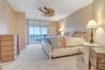 Primary bedroom with access to balcony with Beach Views