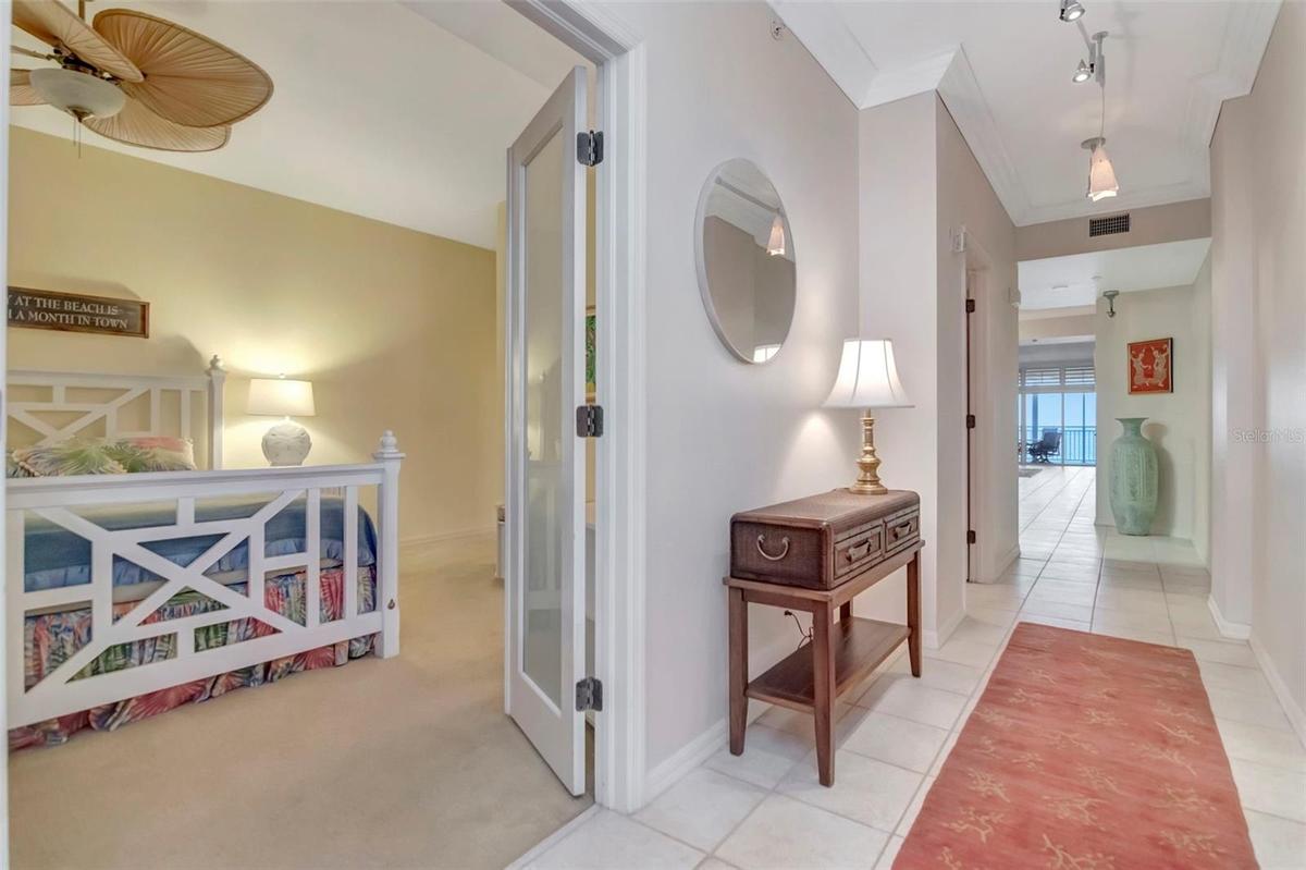 Entrance Hall way with Gulf Beach views - Guest bedroom with its own Bathroom ensuite and walk-in- Split Floor Plan for added privacy