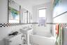The oversized bathroom provides the luxury of both a separate shower and a full tub
