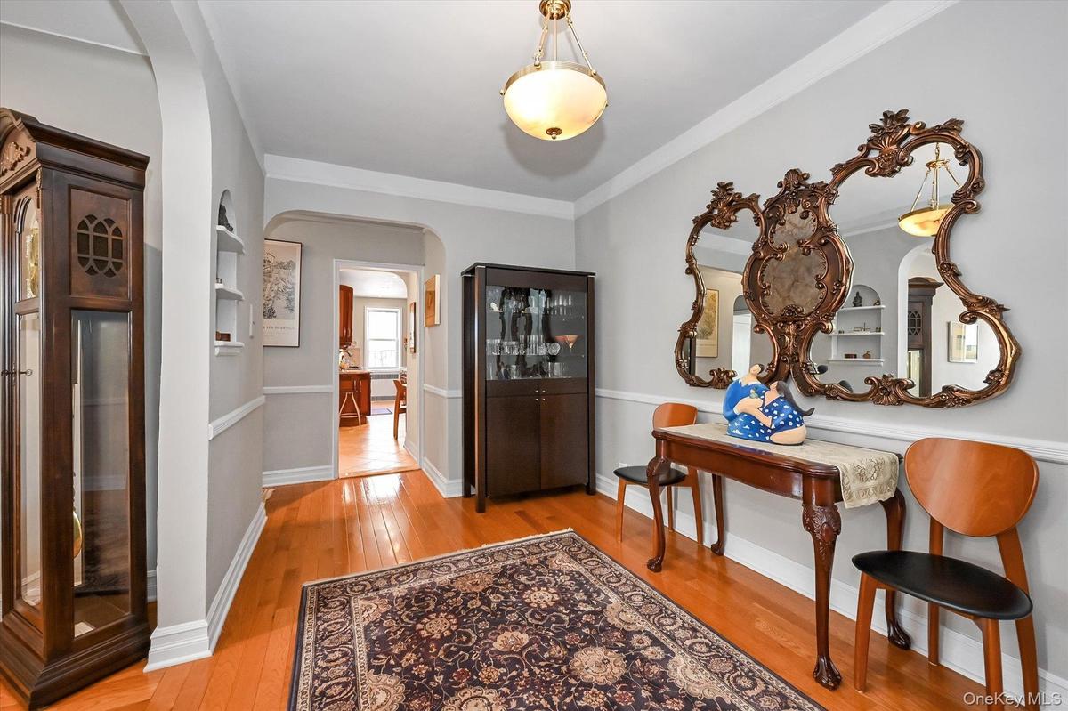Another view of the foyer. with renovated hardwood floors