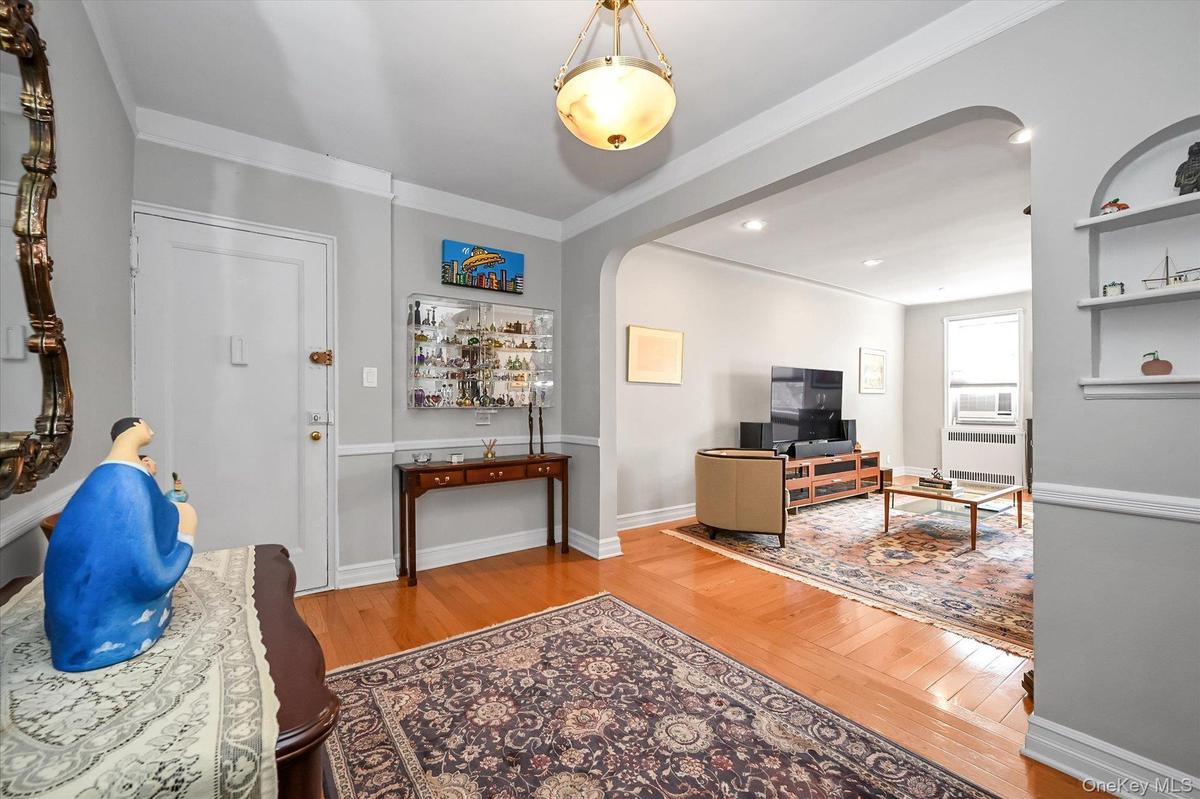 This entrance Foyer couples as a dining room, flowing naturally into the living room for entertaining