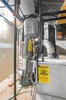 Mechanical room featuring a water heater, expansion tank, and furnace