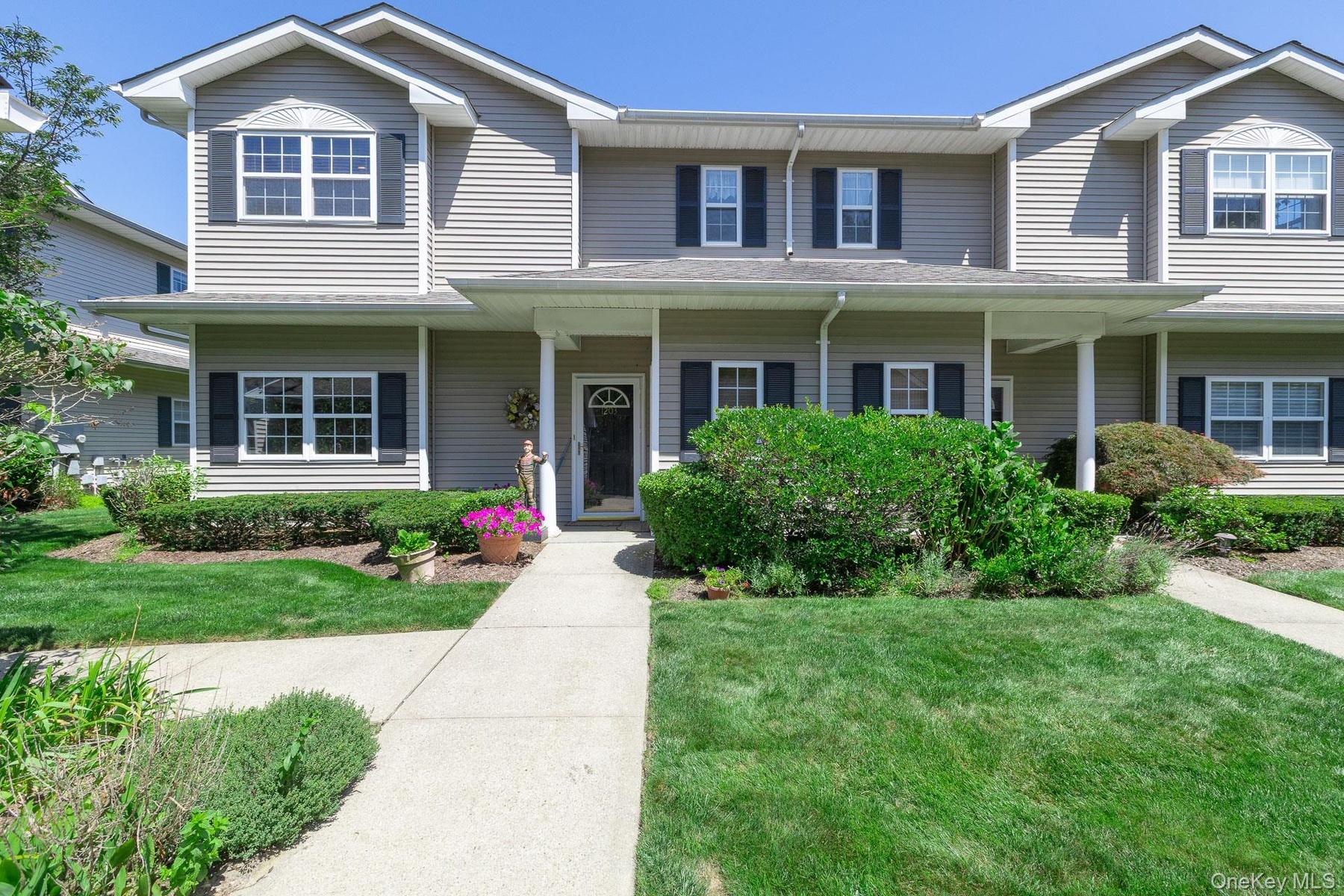 Front view of Unit featuring detached 1 car garage