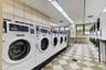 On-site laundry room with multiple machines for convenience