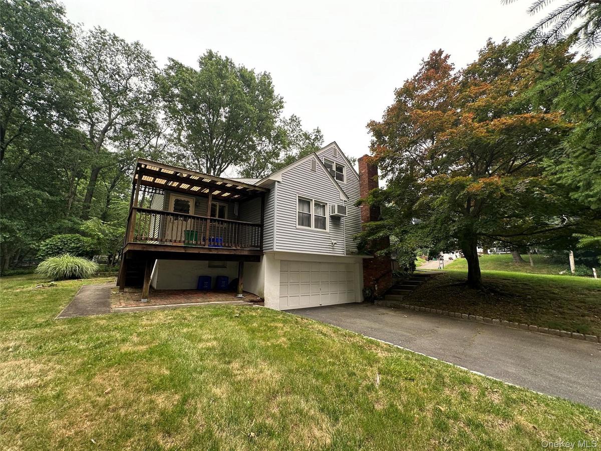 COVERED REAR PORCH, 2 CAR BUILT IN GARAGE