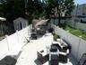 Expansive patio featuring light-colored tile flooring
