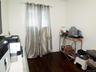 Crisp white walls complement dark wood-finish flooring