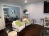 Hardwood-finish flooring extending through an open-concept doorway