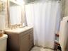 Contemporary vanity with a neutral-toned base, integrated sink, and light-toned countertop