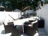 Expansive paved patio with privacy fencing