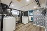 Laundry area featuring light wood-style floors and washing machine and dryer