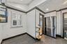 Empty room with ornamental molding and recessed lighting