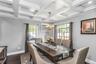 Open Floorplan Dining Room with coffered ceiling off of the Living room and opens to the beautifully designed Kitchen