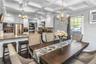 Open Floorplan Dining Room with coffered ceiling off of the Living room and opens to the beautifully designed Kitchen