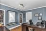 Bedroom located on the main floor or use for a Home Office or a Den complete with built-in bookshelves and window seat