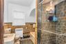 Classicly designed Bathroom with separate shower and tub features