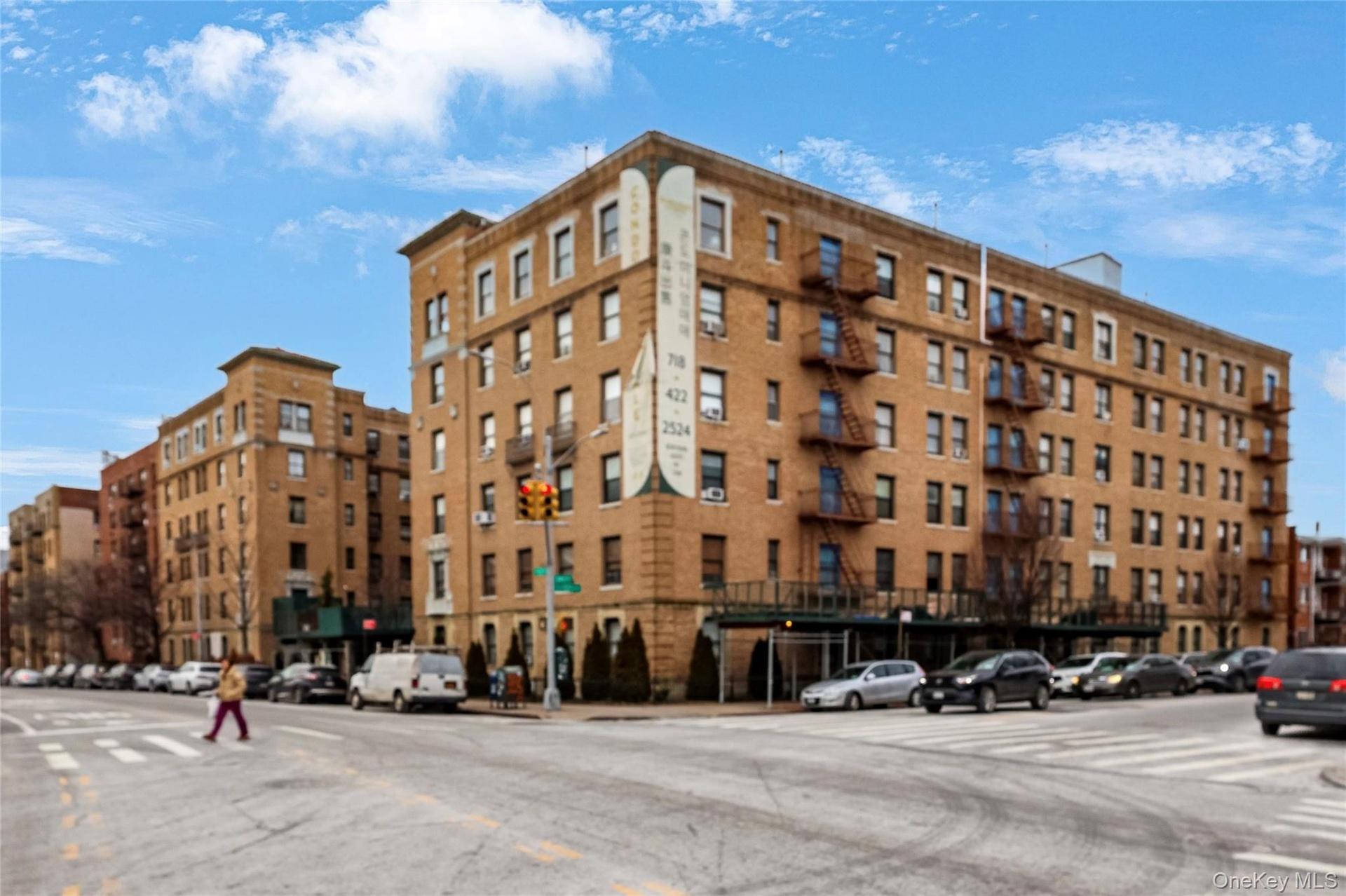 Brick exterior building featuring multiple levels and window units
