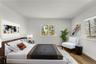 Another view of virtually staged primary bedroom.
