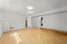 View of the family room.  Laundry closet is in the center and full bath beyond that.  Office is on the right.