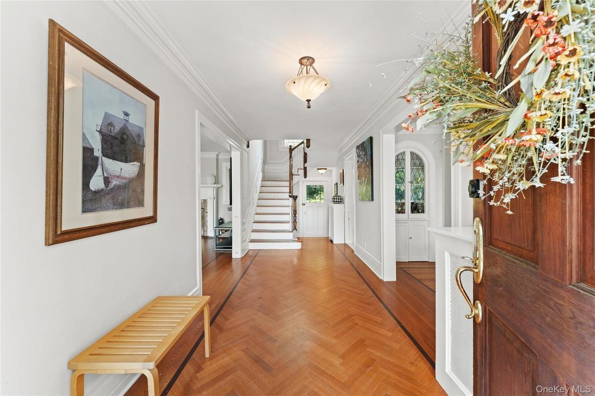 This exceptional 6 bedroom colonial features gorgeous herringbone floors.