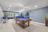 Finished Basement with a lounge area and billiards table