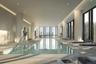 Indoor swimming pool featuring floor-to-ceiling windows, recessed lighting, tile flooring, and a cityscape backdrop