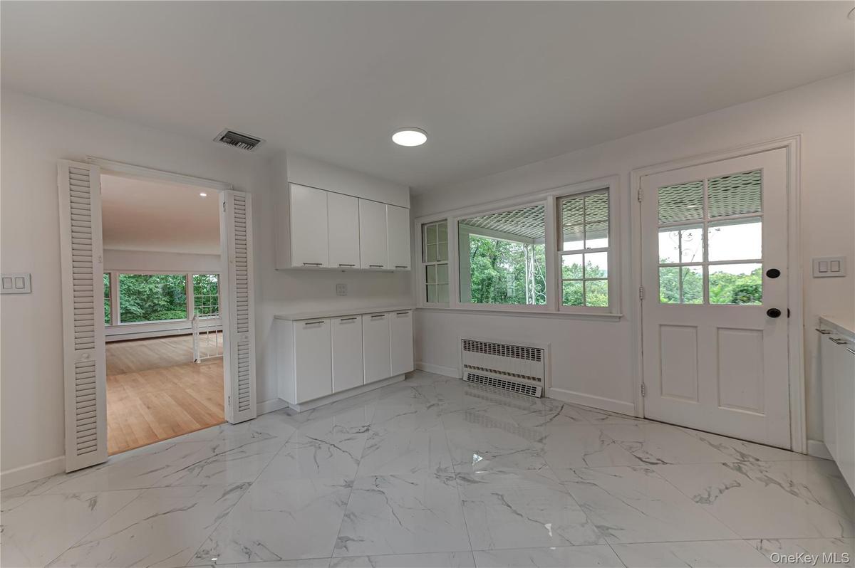 Eating area in Kitchen, opens to a covered porch for summertimeentertaining