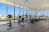Rooftop fitness center with 3 full window walls with amazing views as you work out