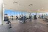 Rooftop fitness center with 3 full window walls with amazing views as you work out