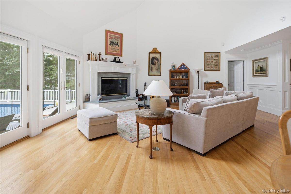 With wood-burning fireplace and vaulted ceilings