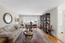 Living space featuring hardwood flooring and light-toned walls