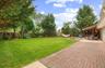 Beautifully Landscaped Oversized Yard with Pavers and Concrete Patios.