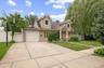 Custom Oversized Portico Welcomes you into this Unique Home while the Double Driveway has enough room for four cars or plenty of on street parking for