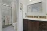 This is the Primary Bathroom and adjacent to it is a very generous size walk-in closet.