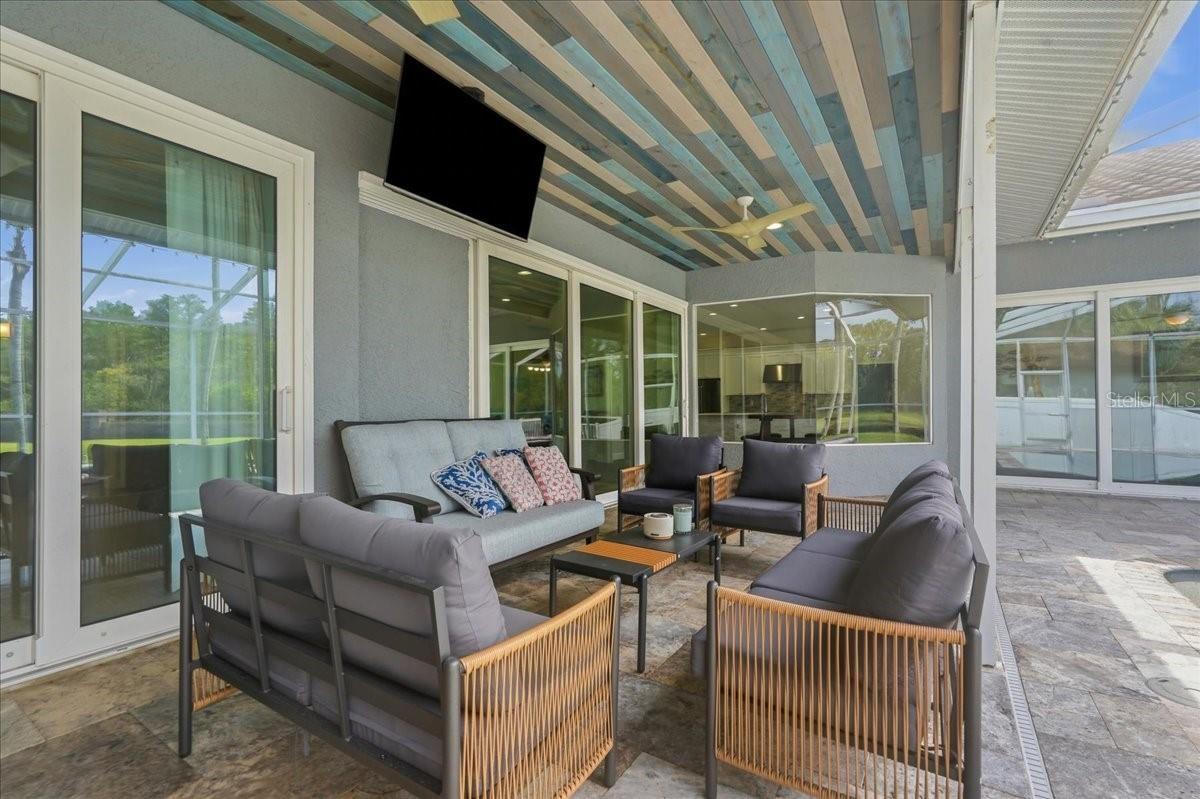 Covered poolside patio area perfect for gatherings