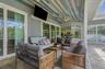 Covered poolside patio area perfect for gatherings