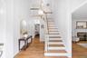 Step into a welcoming foyer that sets the tone for the home with an open feel, wood floors throughout and thoughtfully designed interior.