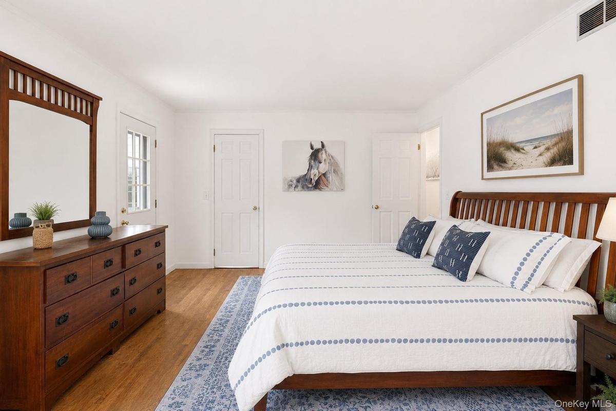 A bright a spacious primary ensuite with abundant natural light, generous proportions and peaceful views.