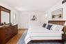 A bright a spacious primary ensuite with abundant natural light, generous proportions and peaceful views.