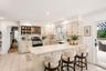 Bright and functional, the kitchen features ample cabinetry, generous workspace and an inviting open layout.