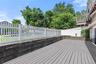 Expansive deck with access to the family room and the dine-in kitchen.