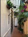 Passageway to in-law suite/2nd primary bedroom at the back of the house with private entrance.