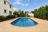 Rectangular swimming pool surrounded by paver patio