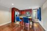 Kitchen featuring wood-finish flooring, recessed lighting, and crown molding