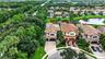 Mediterranean-style residence with a red tile roof and solar panels