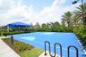 Regulation-size basketball court featuring a vibrant blue surface with lighter blue accents