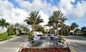Grand entry featuring a multi-tiered fountain with blue and white mosaic tile accents