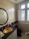 1st Floor Half Bath next to Laundry Room, Pantry and Kitchen.